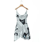 YENKYE New Women Newspaper Letter Print Irregular Hem Sling Dresses Fashion Backless Thin Straps With Chain Summer Sexy Dress