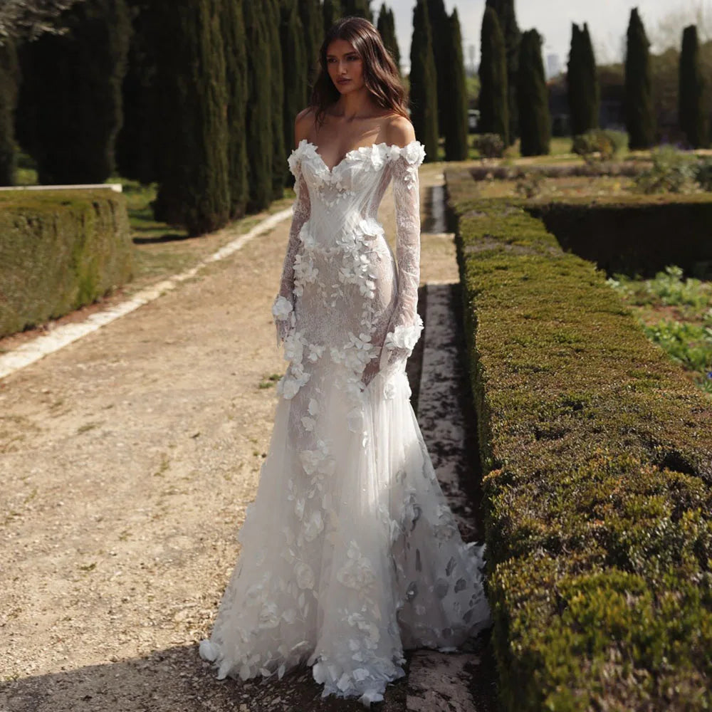Graceful White Wedding Dress Features Floral Embellishments Long Sleeves With Deep V Neckline Flowing Fabric Creates Graceful Main image