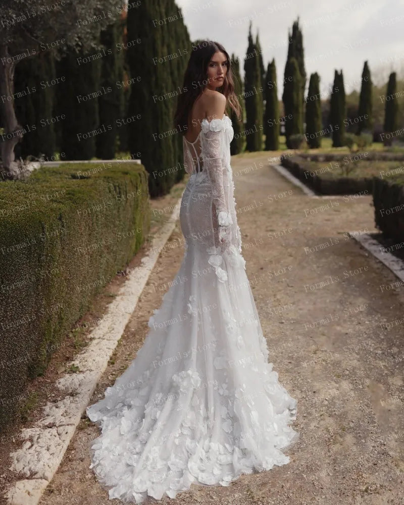 Graceful White Wedding Dress Features Floral Embellishments Long Sleeves With Deep V Neckline Flowing Fabric Creates Graceful